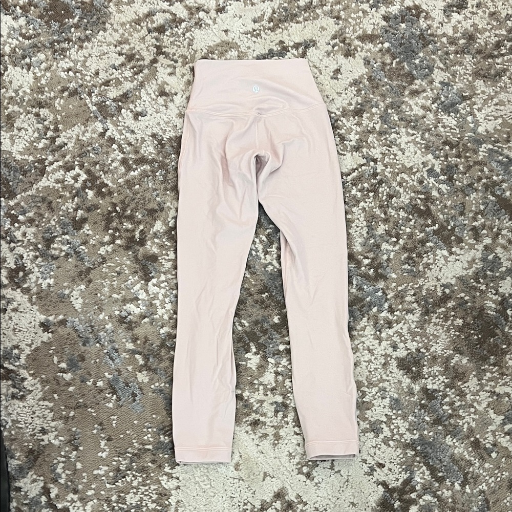 Light blush pink Lululemon leggings.
